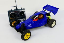 Kyosho - An unboxed Kyosho 1:10 scale nitro RC Sandmaster Buggy.