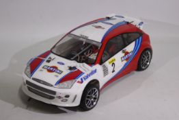 Kyosho - An unboxed Kyosho 1:10 scale nitro RC Ford Focus WRC.