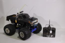 Tamiya - An unboxed vintage Tamiya 1:10 electric RC 4x4x4 'Super Clod Buster' Monster Truck.