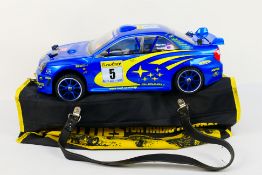 Kyosho - An unboxed Kyosho 1:10 scale nitro Front Wheel Drive RC Mantis GPFF Subaru Impreza.