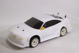 Kyosho - An unboxed Kyosho 1:10 scale nitro RC QRC Opel Calibra V6.