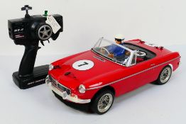 Kyosho - An unboxed Kyosho 1:10 scale nitro RC Spider MGB Mk.1.