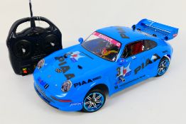 Kyosho - An unboxed Kyosho 1:10 scale nitro RC Spider Special Chassis with Tamiya Porsche 911