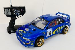 Kyosho - An unboxed Kyosho 1:10 scale electric 4WD RC PureTen EP Alpha Subaru Impreza.