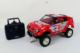 Kyosho - An unboxed Kyosho 1:10 scale nitro RC 4WD QRC Series Mitsubishi Pajero Evolution For The