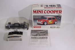 Kyosho - A boxed partially assembled Kyosho #16800 1:10 scale electric RC Mini Cooper Kit.