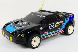 Kyosho - An unboxed Kyosho 1:10 scale nitro RC Ford RS-200.