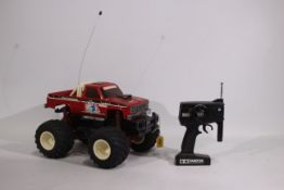 Tamiya - An unboxed vintage Tamiya 1:14 electric RC 'Clod Buster' Monster Truck.