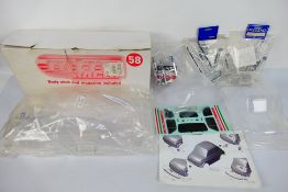 Kyosho - CEN Racing - Three unboxed RC body shells probably in 1:10 scale.