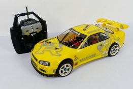 Kyosho - An unboxed Kyosho 1:10 scale nitro RC MSpider Nissan Skyline GTR.