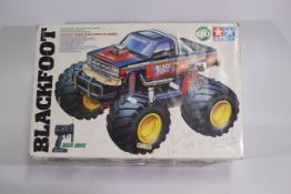 Tamiya - A small quantity of spare parts contained within original box associated with Tamiya