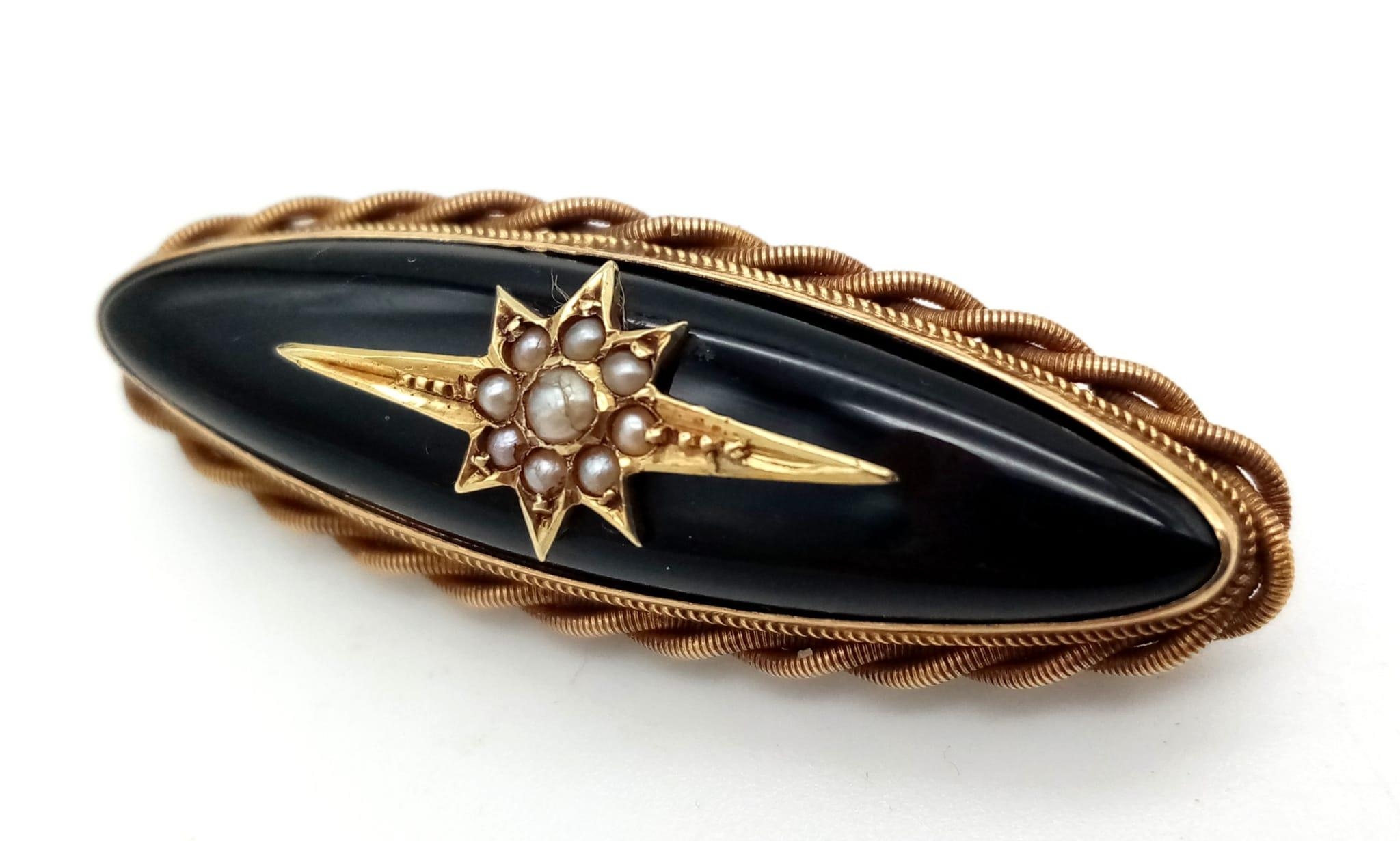 12k yellow gold brooch with black inlay and set with 9 seed pearls weighs 6.7g