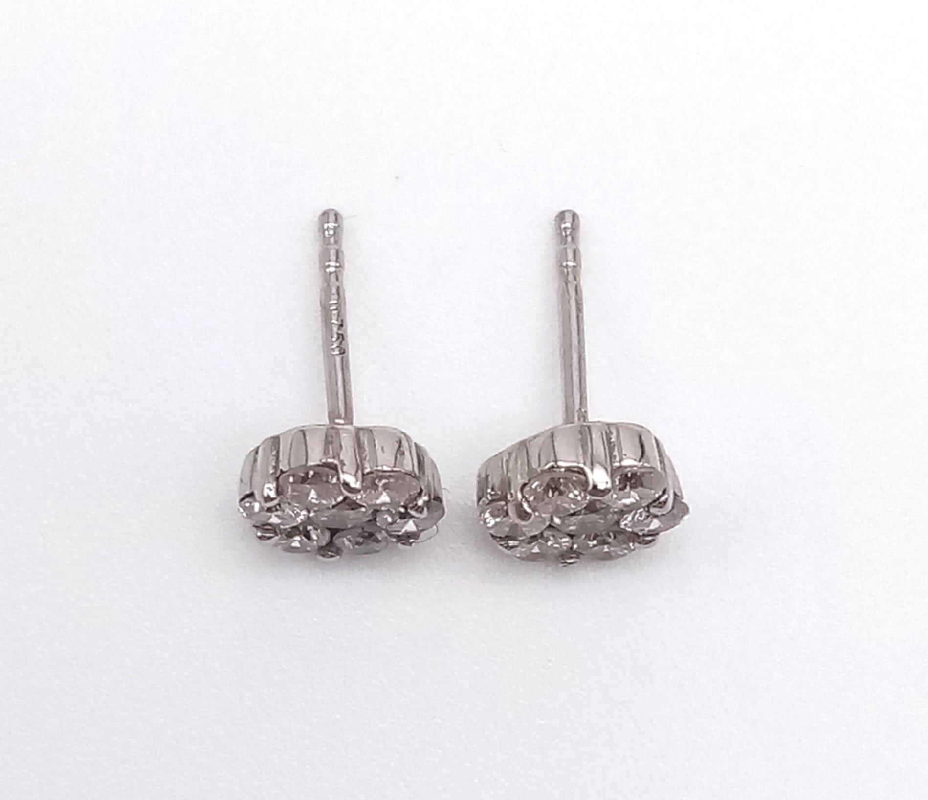 A Pair of 18K White Gold and Diamond Stud Earrings. 14 diamonds in total - 0.40ct. 1.20g total - Image 2 of 6
