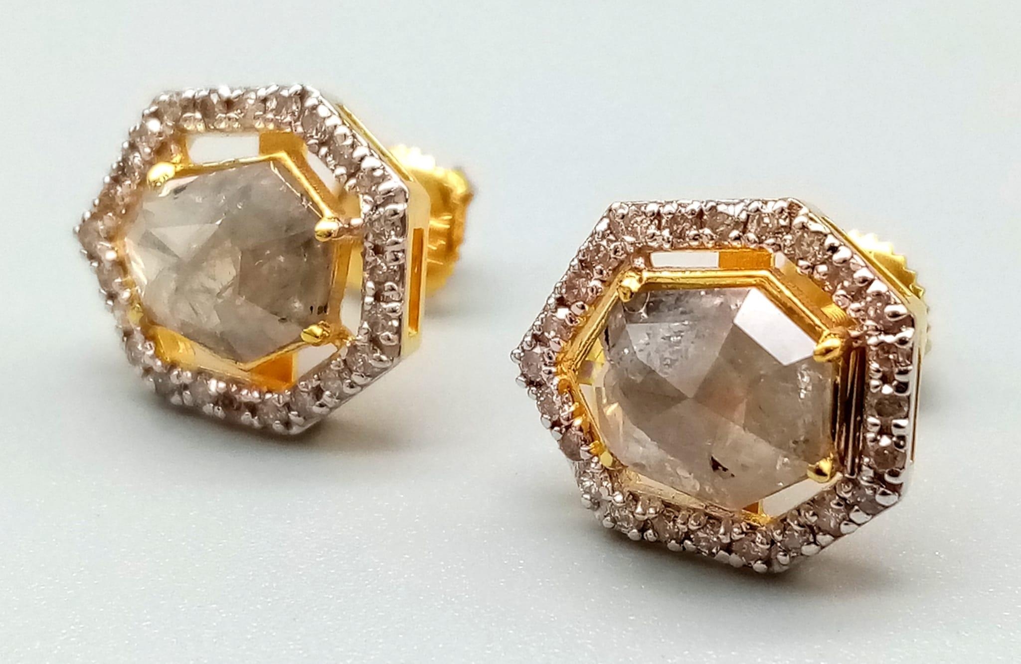 A 2.30ct Pair of Yellow Diamond Stud Earrings in 14k Gold -with .40ct Diamond Accents. 3.1g total