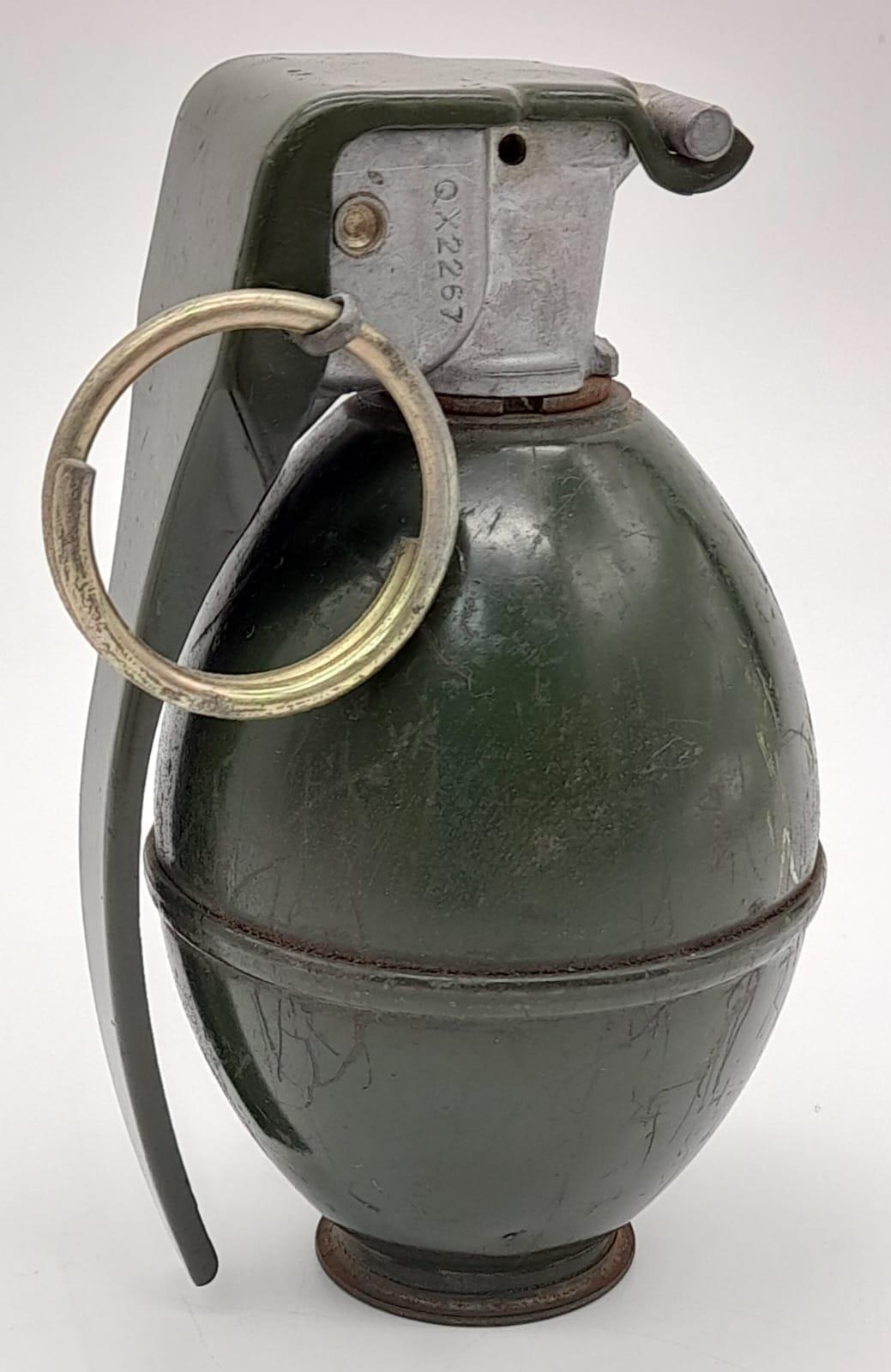 INERT Vietnam War Era US M26 hand grenade. The grenade with a smooth casing and a single rib along