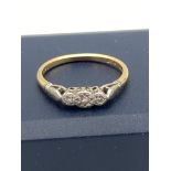 18k GOLD RING having three DIAMONDS set to top and mounted in PLATINUM. Dainty piece of