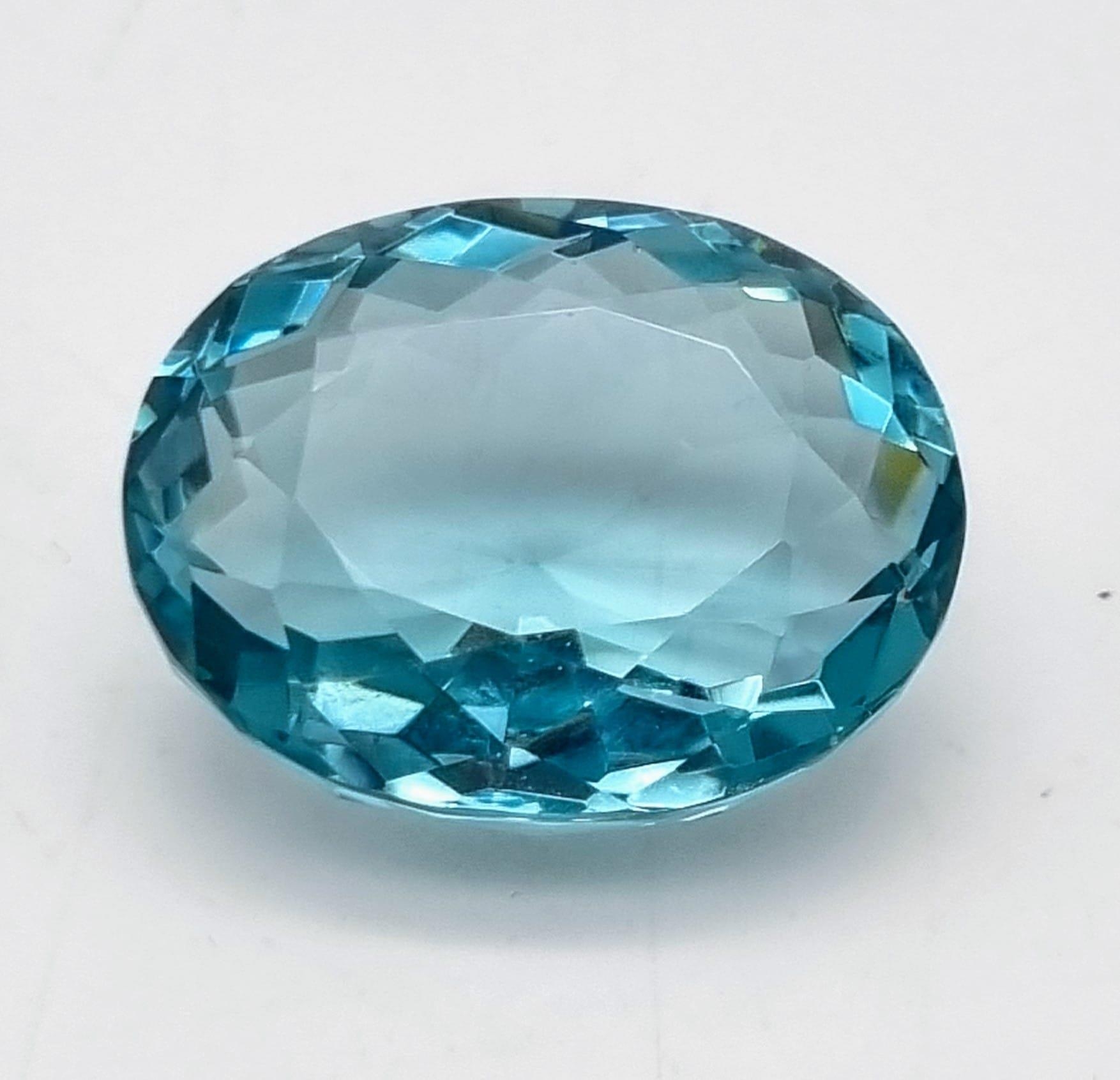 A wonderful, large (63.35 carats) AQUAMARINE. Oval cut, flawless, with excellent colour