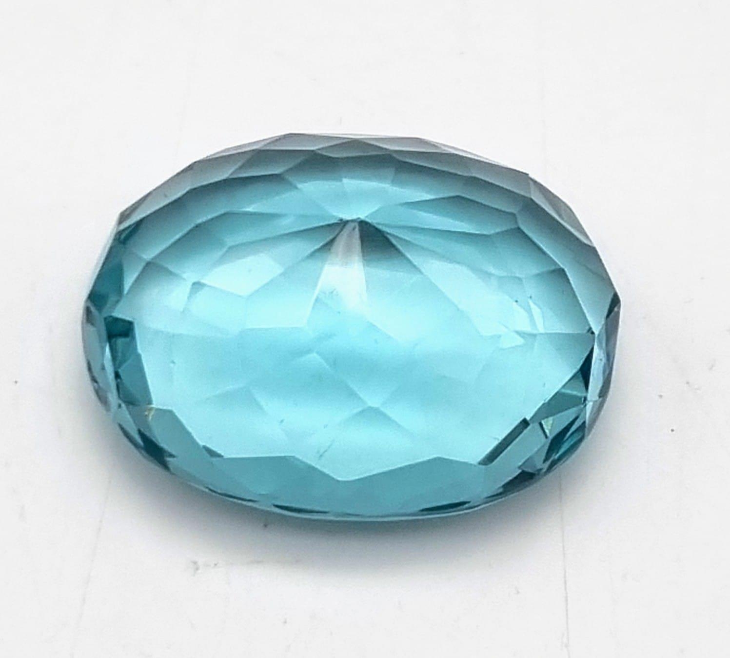 A wonderful, large (63.35 carats) AQUAMARINE. Oval cut, flawless, with excellent colour - Image 3 of 3