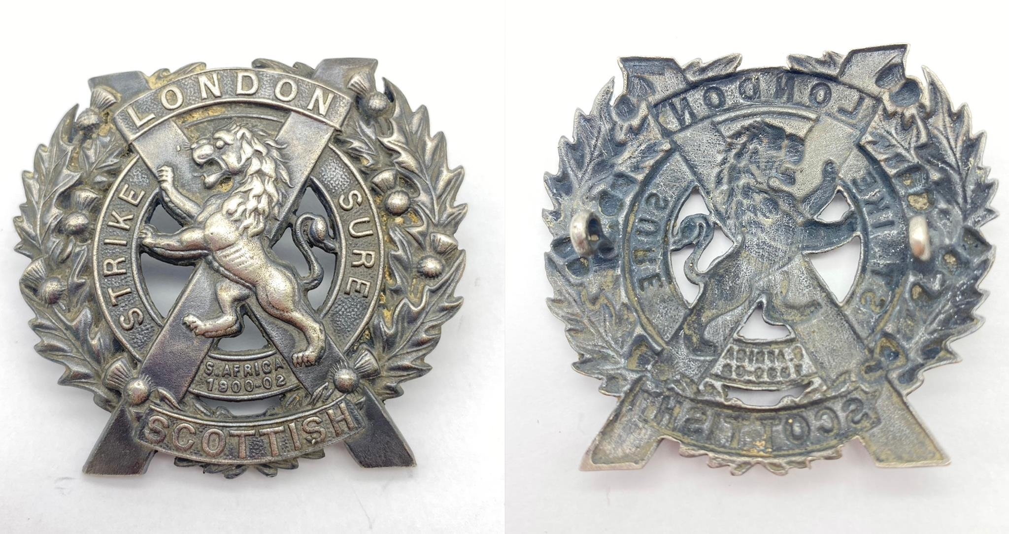 WW1 British London Scottish Regiment Silver Cap Badge. The badge depicting a Lion in a St. Andrews