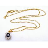 A Beautiful Sapphire and Diamond Pendant set in 9K Yellow Gold with a 9K Yellow Gold Necklace.