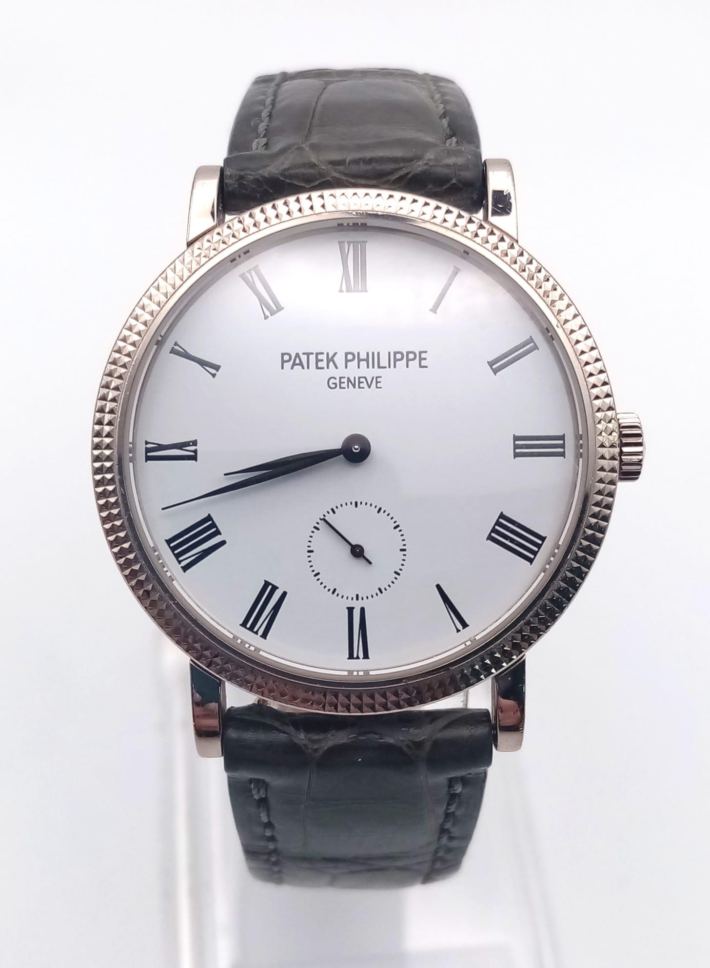 A Patek Phillipe Calatrava 18K White Gold Gents Watch. Leather strap. Gold case - 31mm. Mechanical