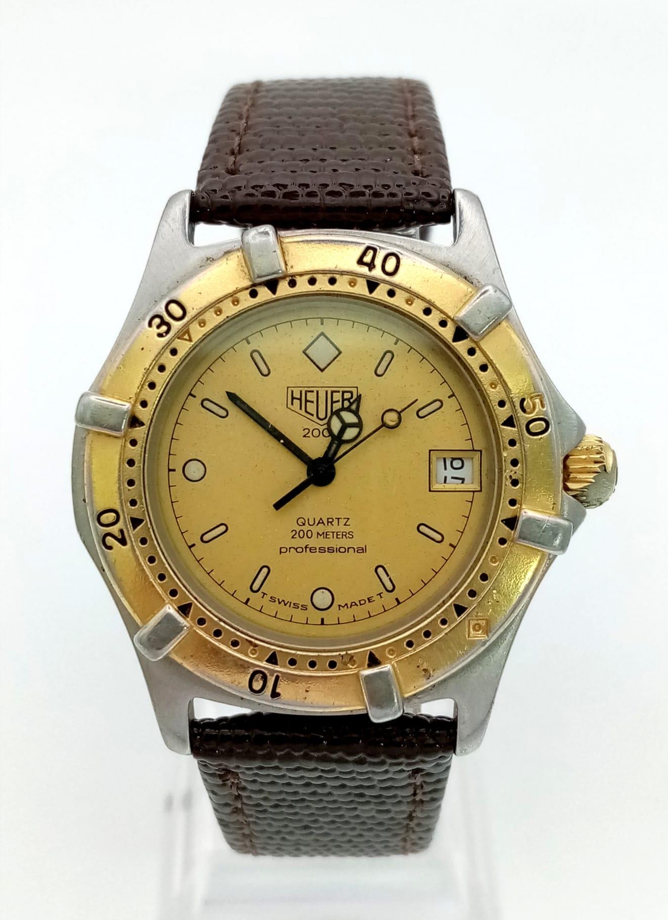 A Tag Heuer 2000 Professional Unisex Divers Watch. Brown leather strap. Two-tone stainless steel