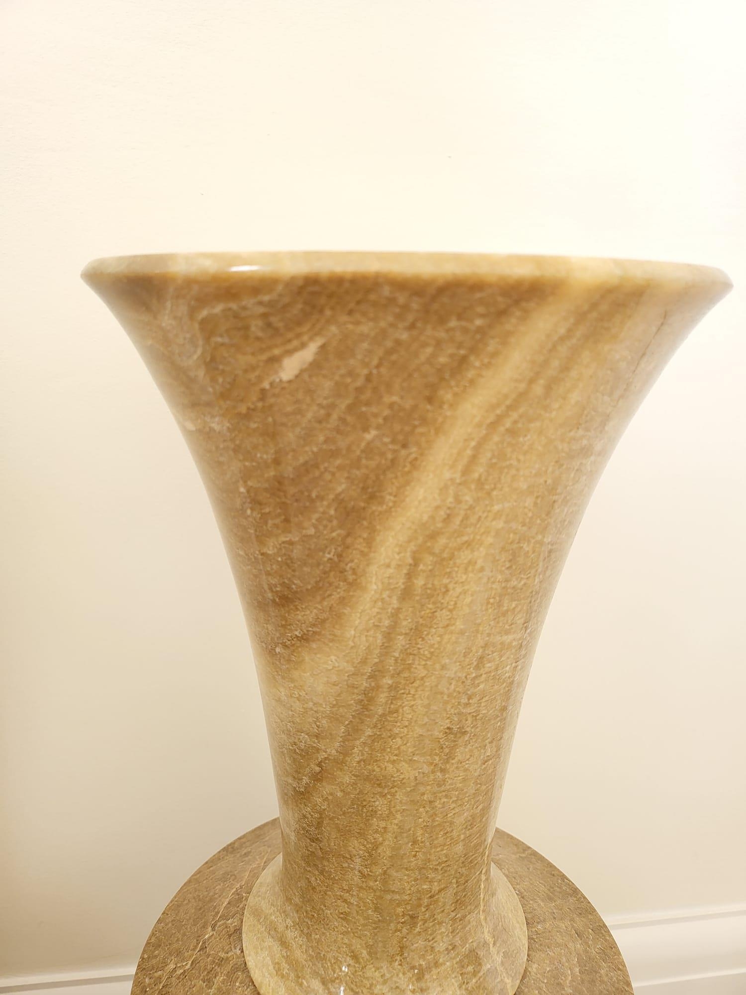 A Pair of Large Beige Polished Stone Vases. Both on dark wooden stands. 56cm tall. 20cm width. - Image 3 of 7