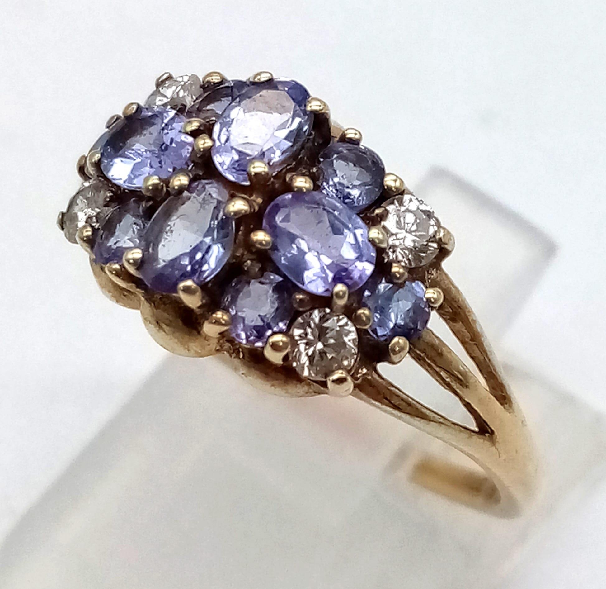 A 9K Yellow Gold Amethyst and White Stone Cluster Ring. Size P. 2.43g total weight. - Image 2 of 4