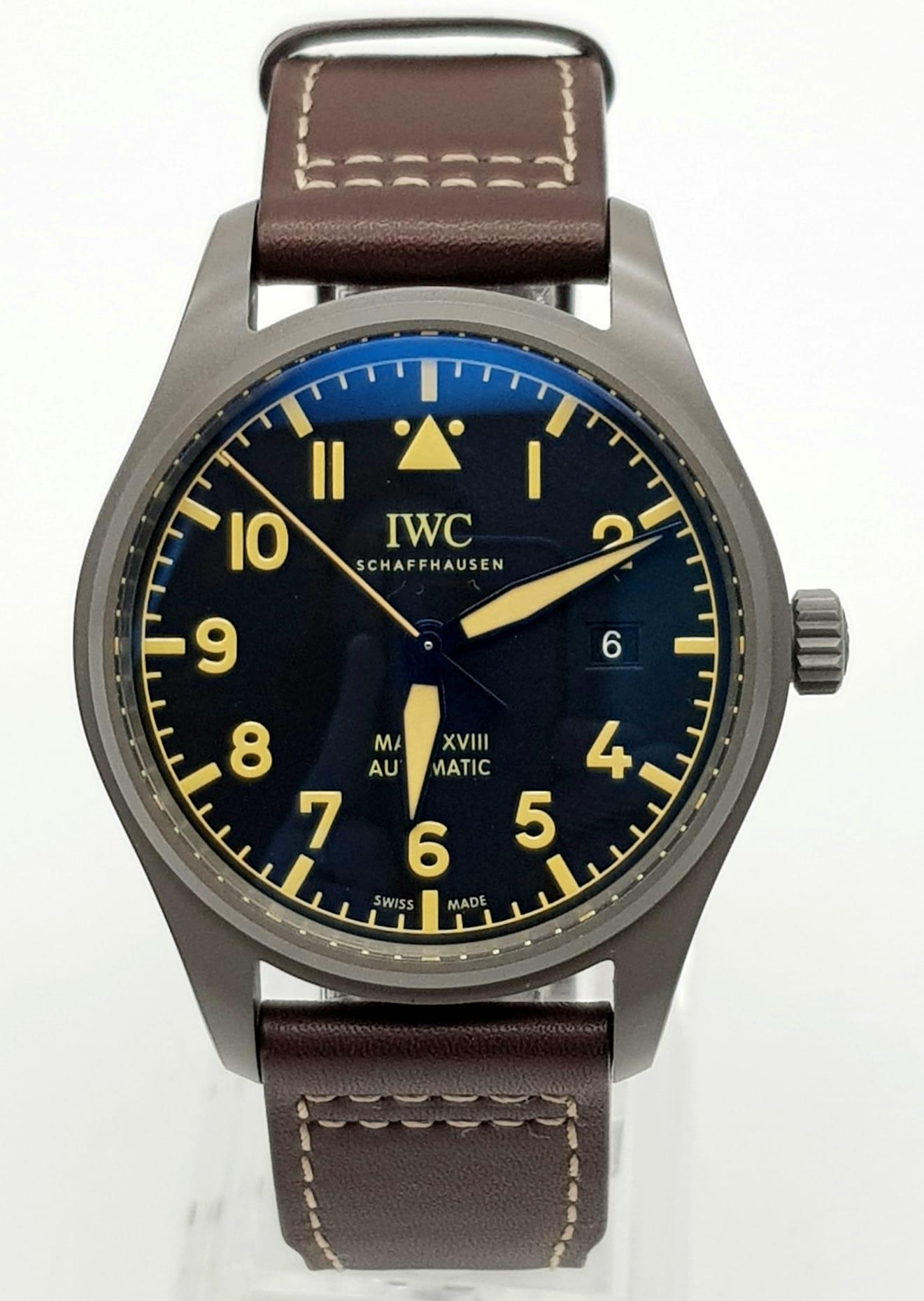 An IWC Mark XVIII Pilots Watch. Brown leather strap. Titanium case - 40mm. Black dial with date