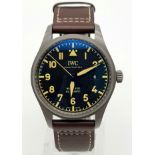An IWC Mark XVIII Pilots Watch. Brown leather strap. Titanium case - 40mm. Black dial with date