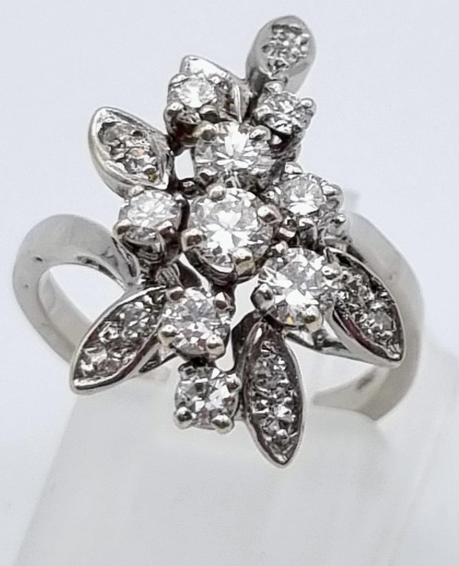 An 18K White Gold Diamond Floral Ring. Size K. 1ct 5.2g total weight.