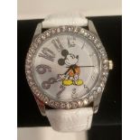 White face MICKEY MOUSE WRISTWATCH with jewelled bezel. Quartz movement .White leather strap. Full