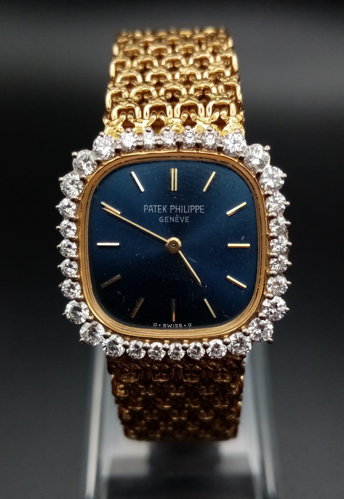 A Patek Phillipe Classic 18K Gold and Diamond Ladies Watch. Woven gold bracelet. Gold case - 24mm.