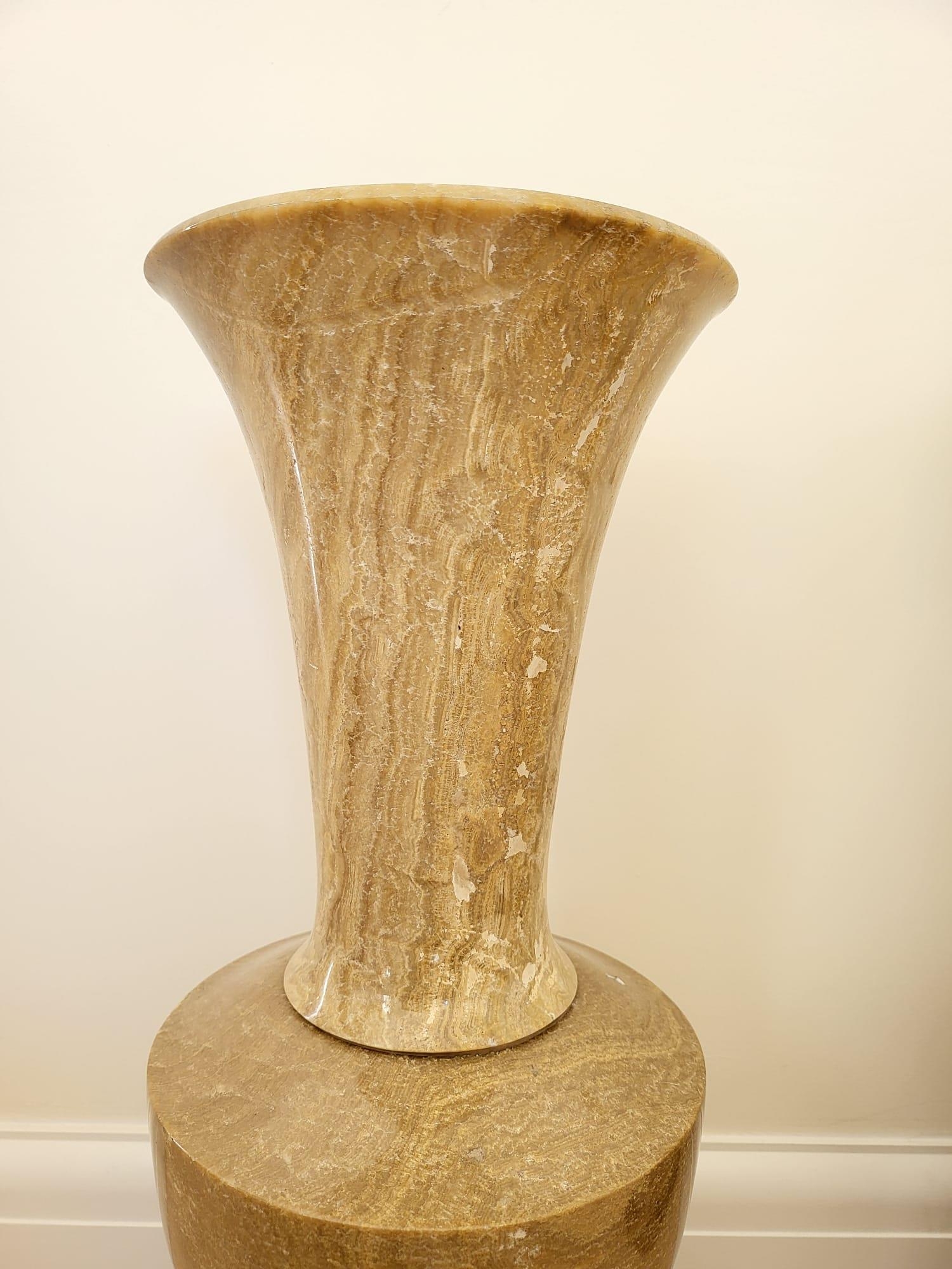 A Pair of Large Beige Polished Stone Vases. Both on dark wooden stands. 56cm tall. 20cm width. - Image 2 of 7
