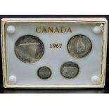 A Boxed Canadian 1967 silver set of coins consisting of 10, 25 and 50 cents and a one Dollar coin,