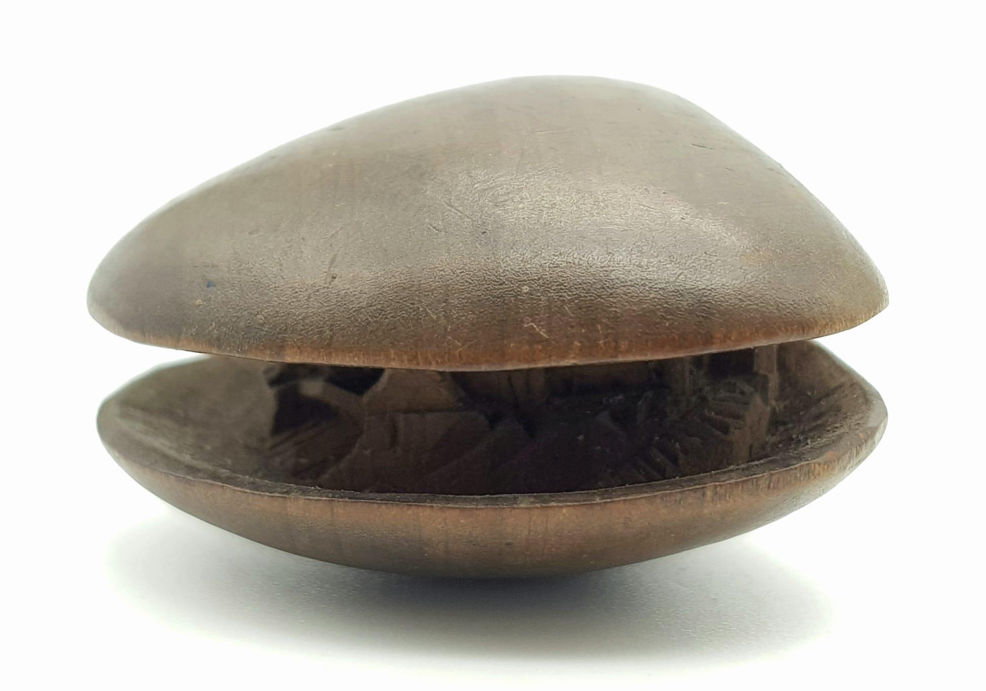 Antique Meiji (1868-1912) Period, Wood Netsuke carving of a small house, set within a clam shell.