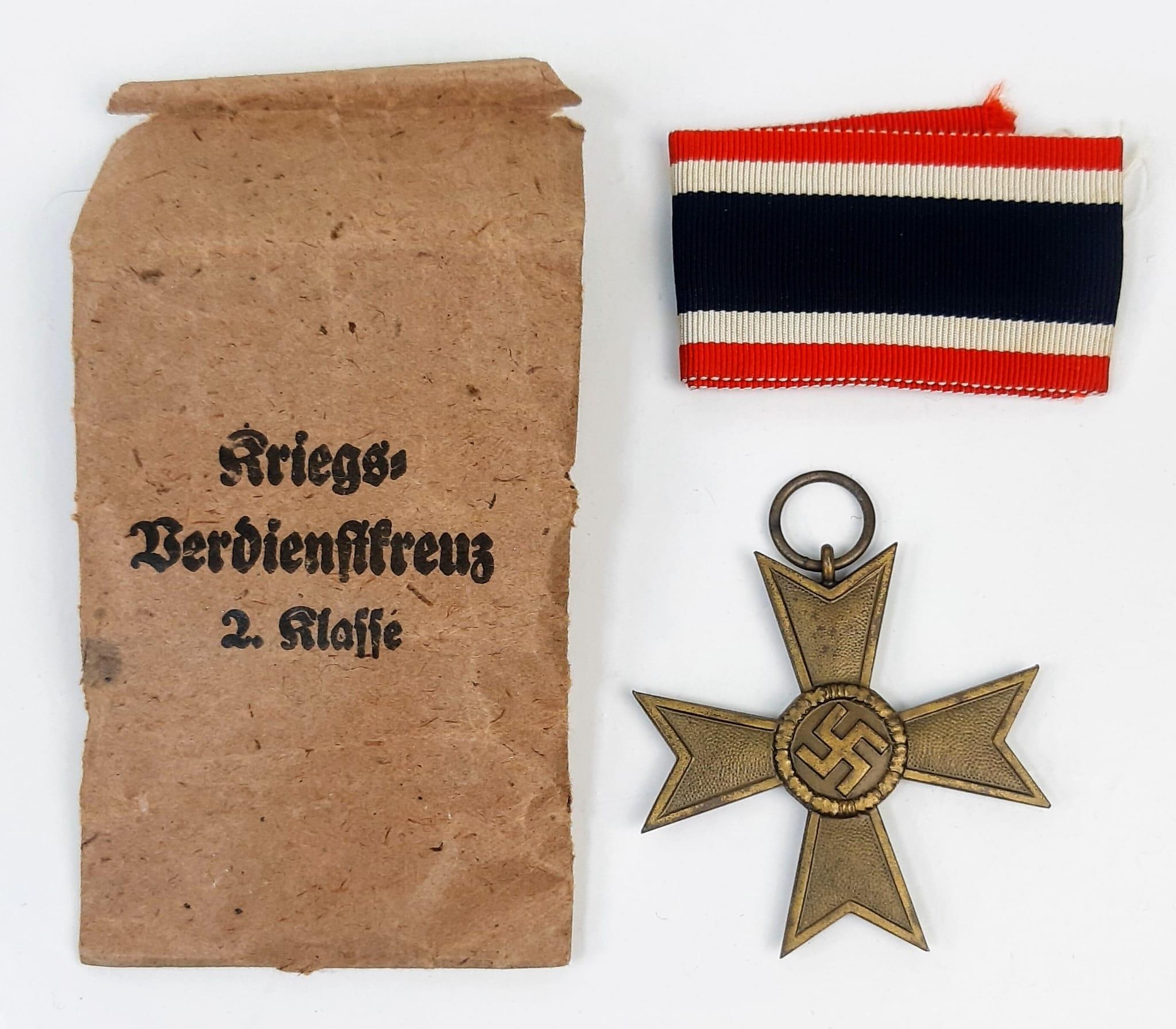 A WW2 Nazi War Merit Cross with Ribbon.