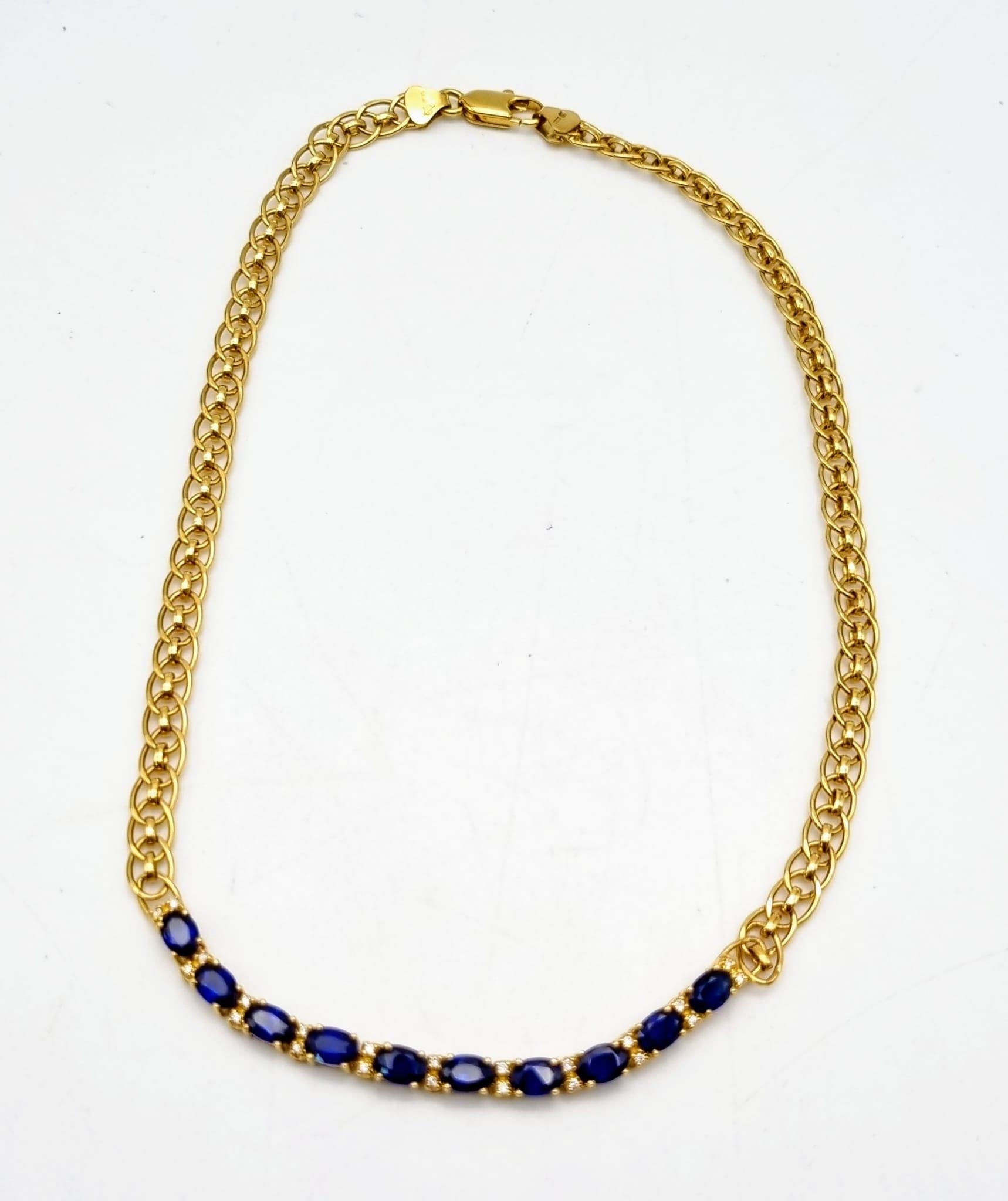 An 18K yellow gold necklace with wonderful oval cut royal blue sapphires and diamonds. Length: 36