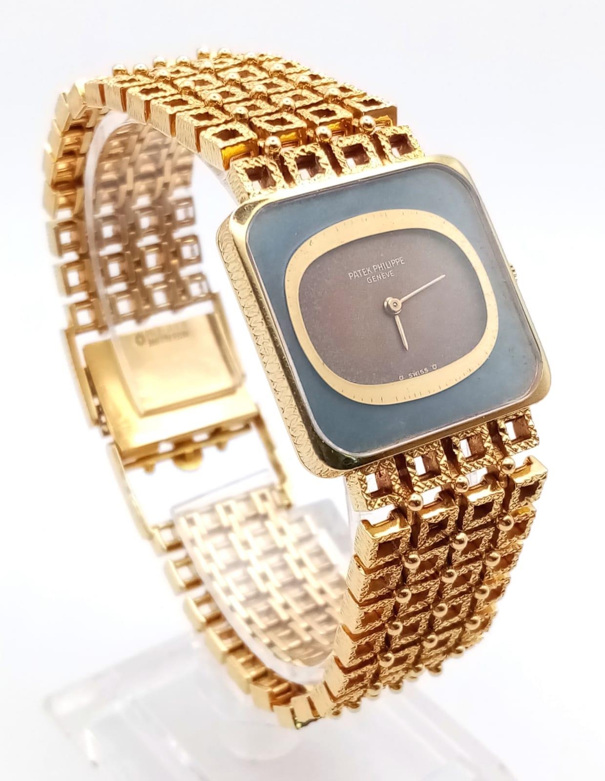 A Patek Phillipe Classic 18K Yellow Gold Ladies Watch. Woven gold bracelet. Gold case - 25mm. Two