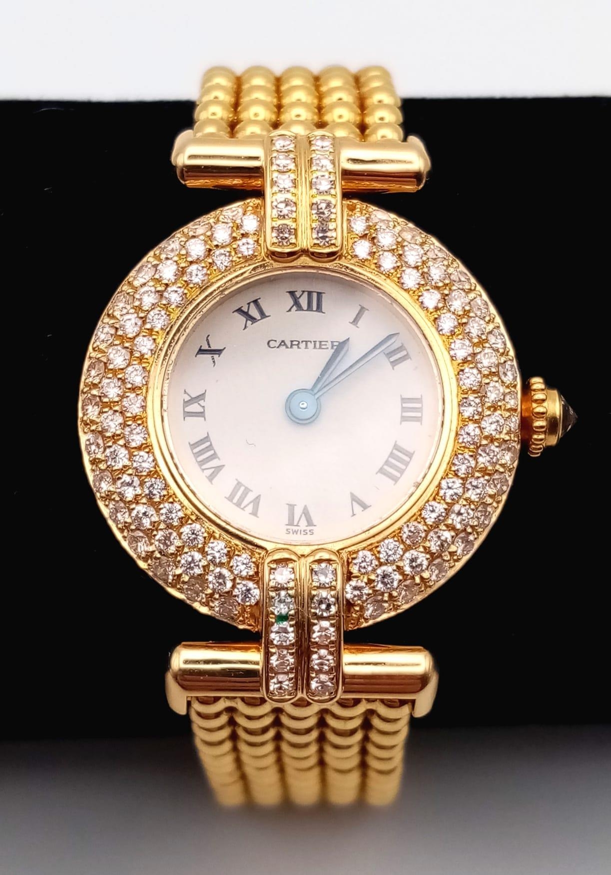 A Cartier 18K Yellow Gold and Diamond Ladies Watch. Gold ball-link bracelet. Gold circular case -