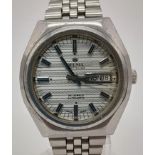 A Vintage Delma 25 Jewel Automatic Gents Watch. Stainless steel strap (new) and case - 38mm.