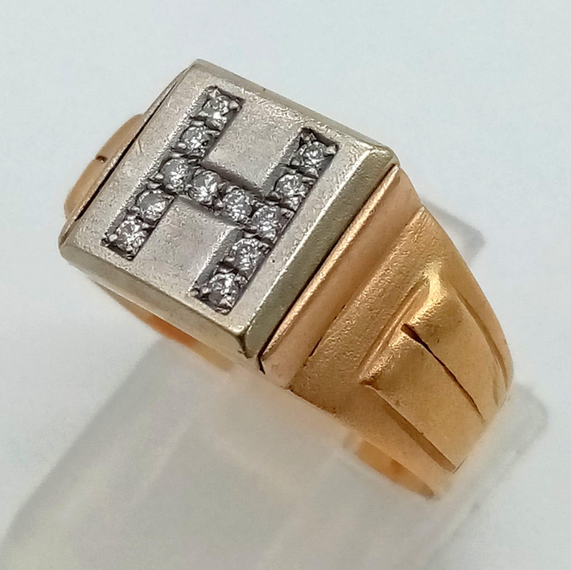 An 18K Yellow Gold, Platinum and Diamond Signet Ring. The letter H is spelled out with 12 - Image 2 of 4