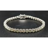 A 14K White Gold Diamond Tennis Bracelet. 46 brilliant round cut diamonds. 10.25ct approx. 19cm.