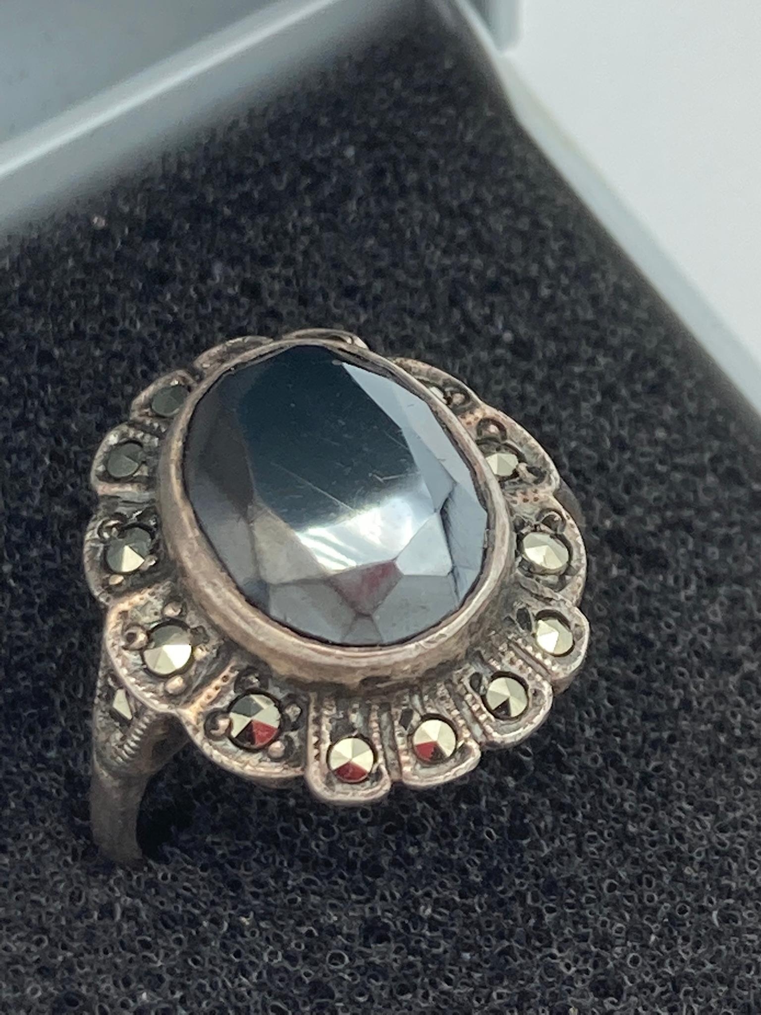 Vintage SILVER and MAGIC TOPAZ RING, having 2 carat oval TOPAZ set to top with SILVER MARCASITE