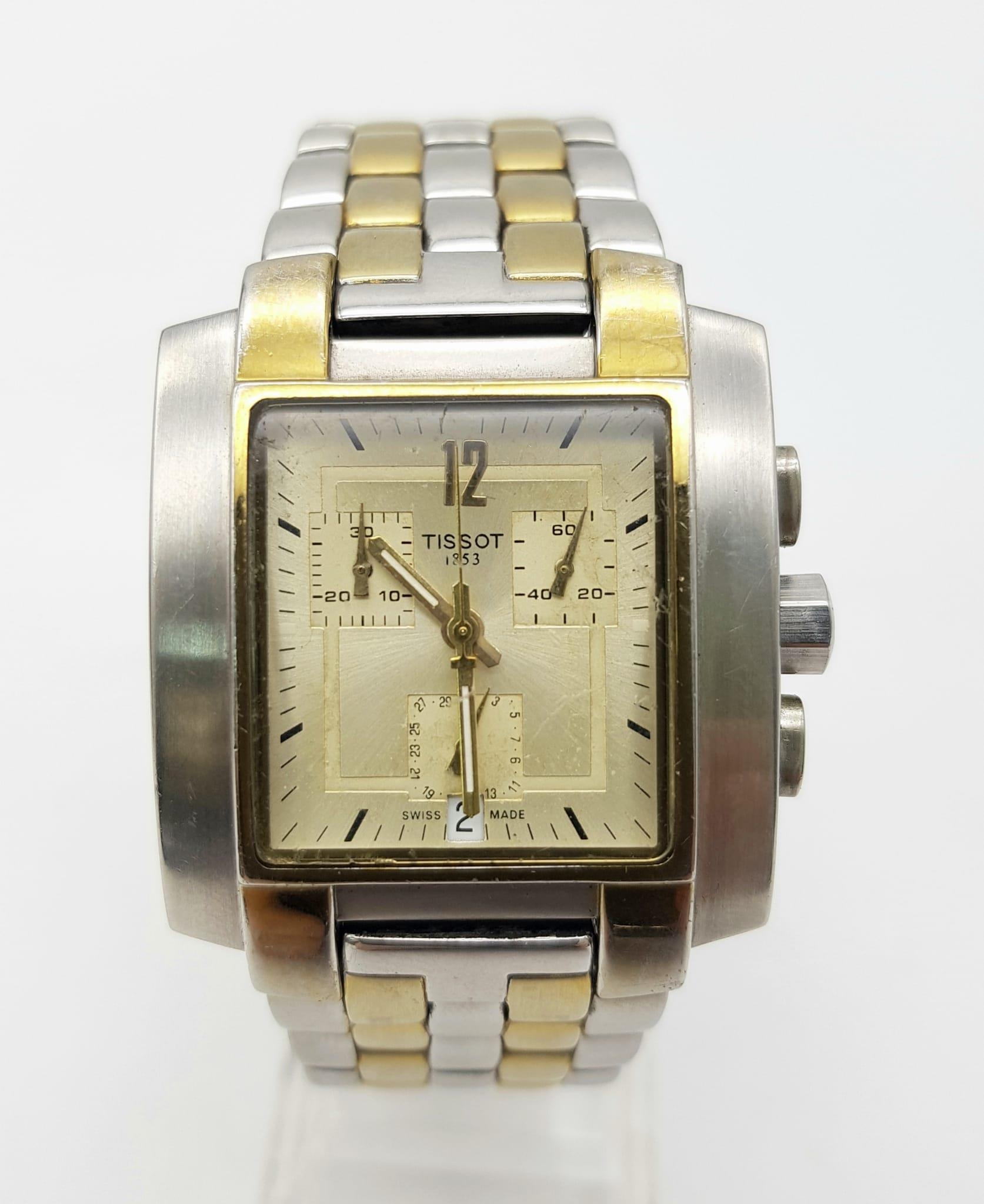 A Tissot 1853 Chronograph Gents Watch. Two-tone strap and case - 35mm. Gold tone dial with three sub