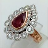 A Gold Plated Silver, Red Stone and Diamond Ring. A central red teardrop stone with two teardrop