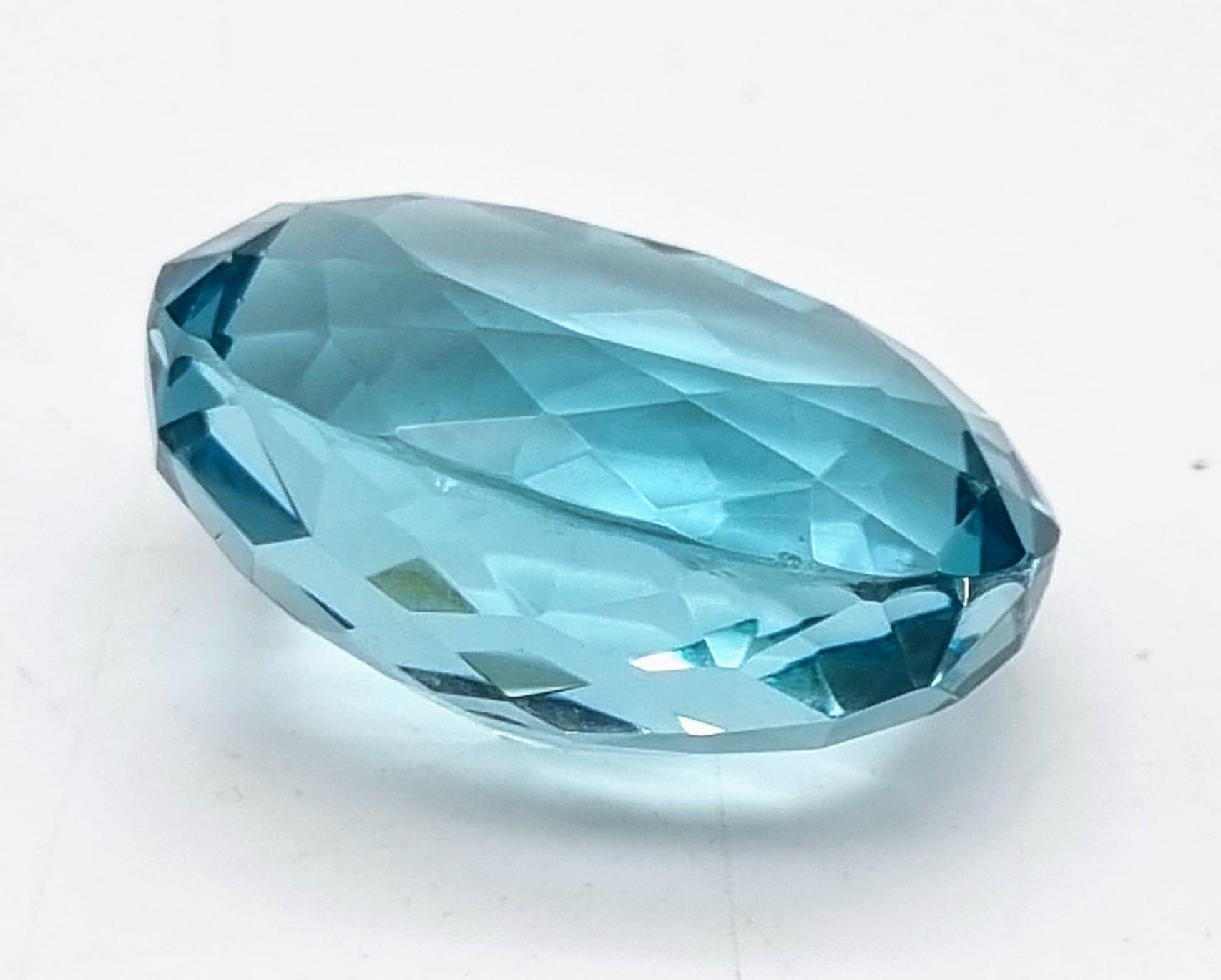 A wonderful, large (63.35 carats) AQUAMARINE. Oval cut, flawless, with excellent colour - Image 2 of 3