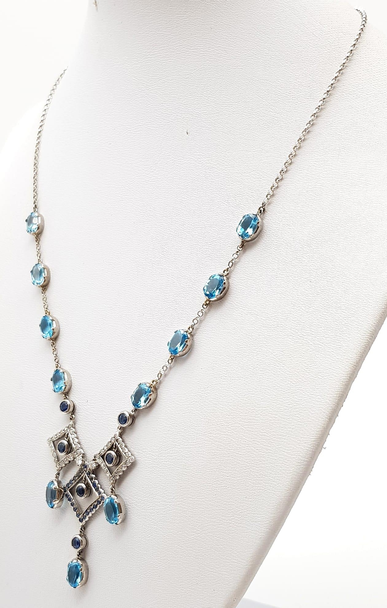 An Elegant 18K White Gold Necklace - interspersed with clean aquamarine stones and climaxing in a - Image 2 of 5