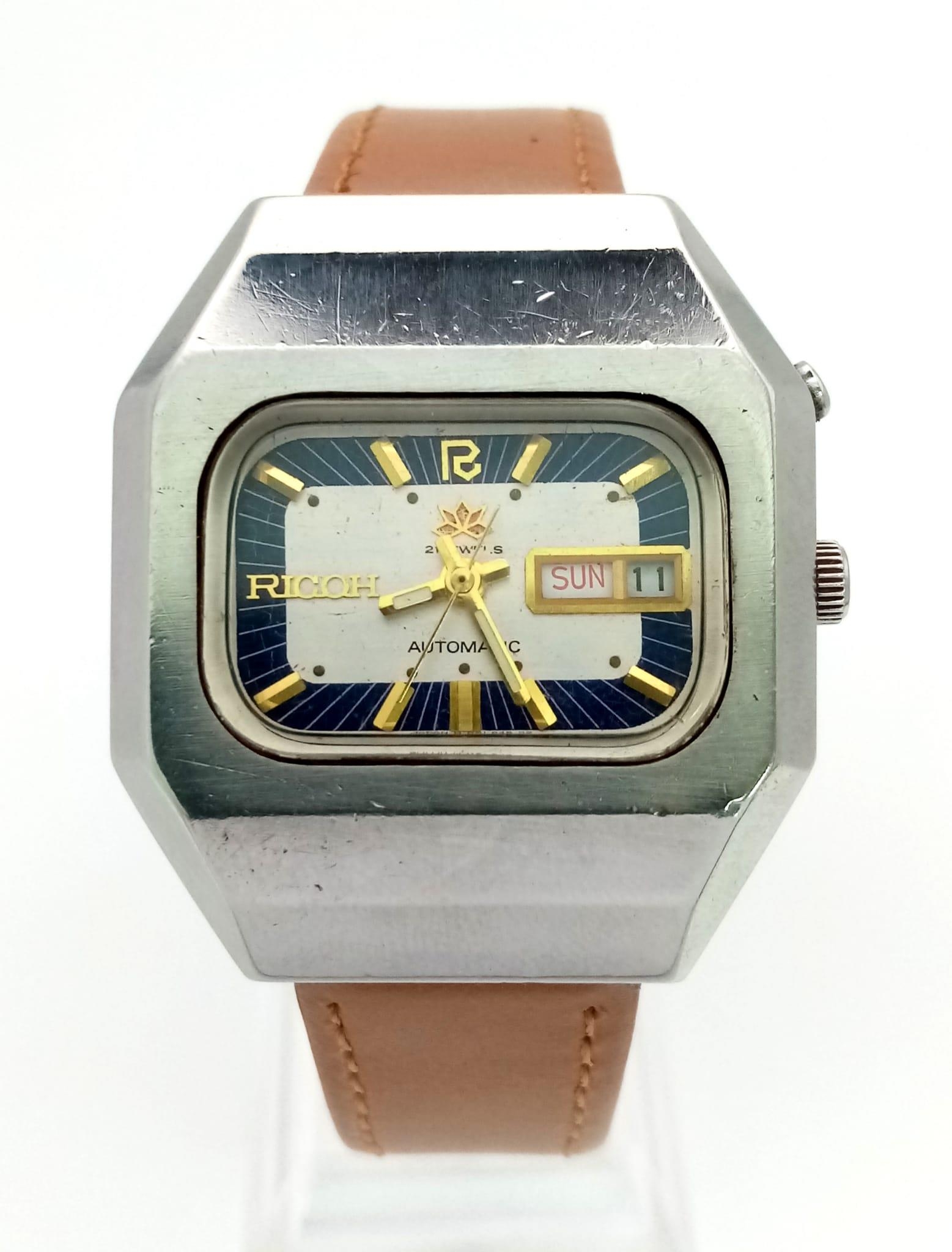 A Rare Vintage Ricoh 21 Jewel Automatic Gents Watch. Brown leather strap. Hexagonal steel case -