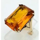 A 9k Yellow Gold Citrine Ring. Rectangular-cut large citrine. Size J. 5.81g total weight.